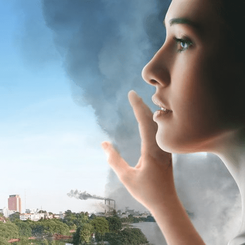 Urban city skyline with pollution and smog, representing environmental stress on the skin barrier.