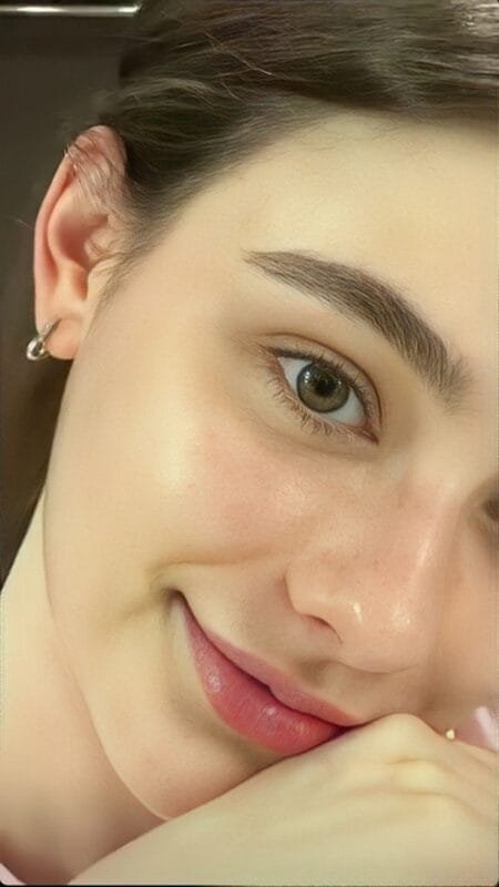 Close-up of a woman with healthy, glowing skin, representing the results of successful skin barrier repair and resilience.